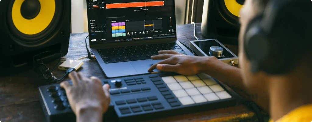 Man manipulating audio equipment, audio interface vs mixer