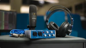 Presonus Audiobox USB 96 Review - Pressonus audio interface sitting on a desk with a presonus microphone and headphones