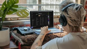 Best Audio Interface for Mac -man sitting in front of a mac computer using an audio interface