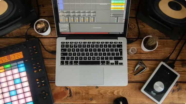 Laptop, and Audio Interface on a wood desk Best Audio Interface Under 500