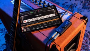 Best Audio Interface Under 50 IK Multimedia iRig 2 connected to an iPad on the top or an Orange amplifier