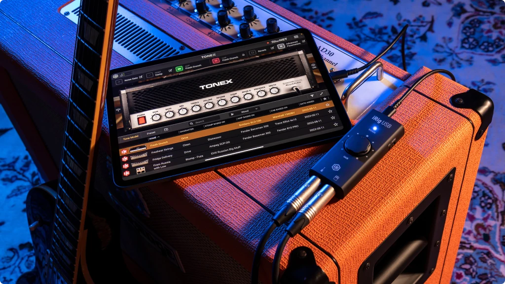 Best Audio Interface Under 50 IK Multimedia iRig 2 connected to an iPad on the top or an Orange amplifier
